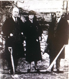     ARKANSAS DEMOCRAT photo of Mayor Overman, Mrs. Robinson and Mr. Allaire at the groundbreaking. The Broadway Bridge balustrades are visible in the background.